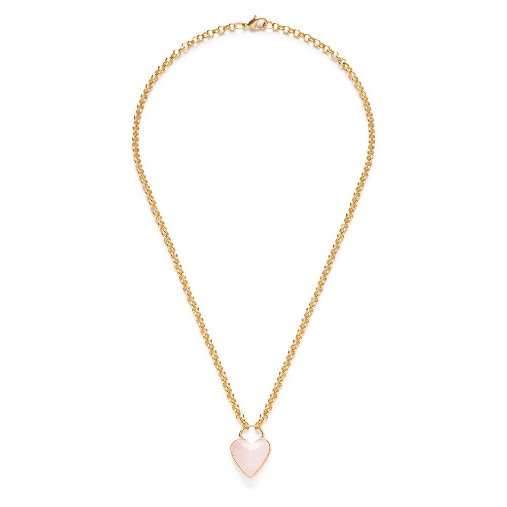 Gold necklace with a heart-shaped pink pendant on a white background