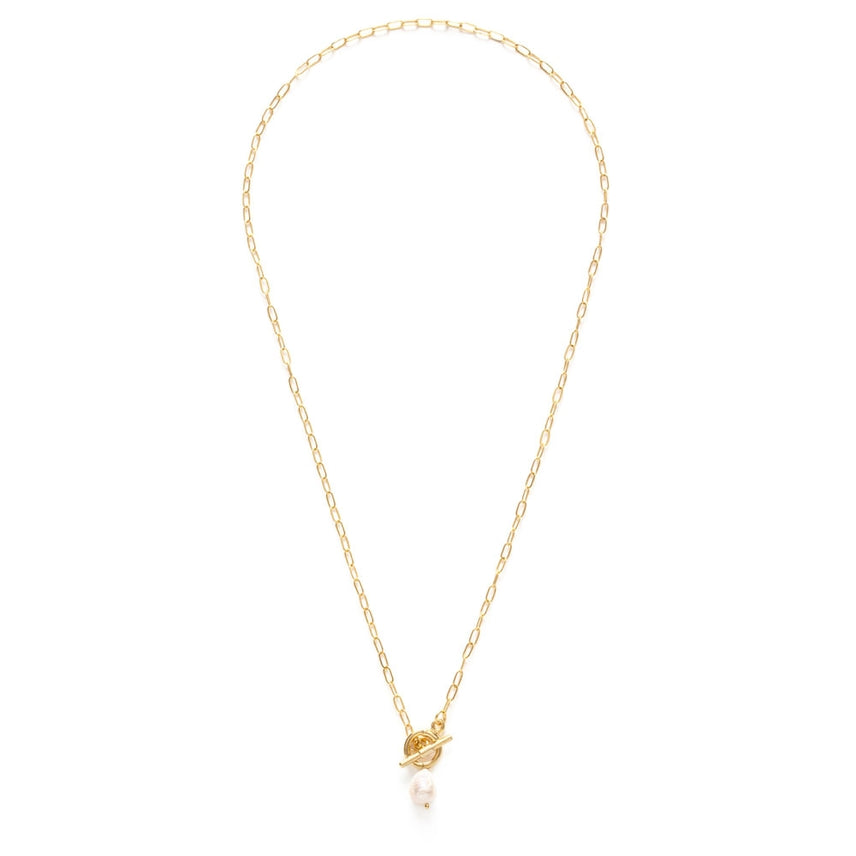 Gold necklace with a small pendant on a white background