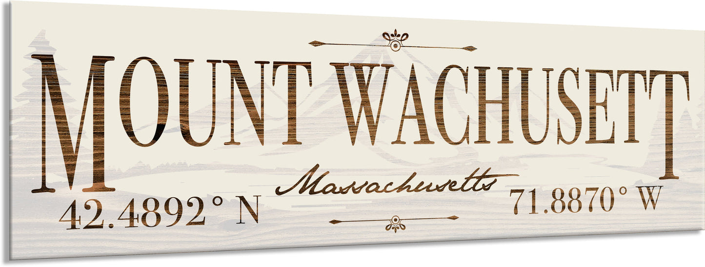 Wooden sign with 'Mount Wachusett Massachusetts' and coordinates on a white background