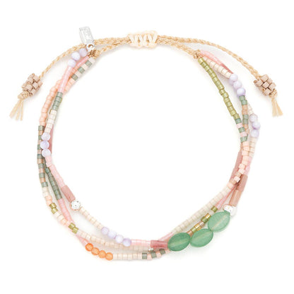 Bracelet with multiple strands of multicolored beads on a white background
