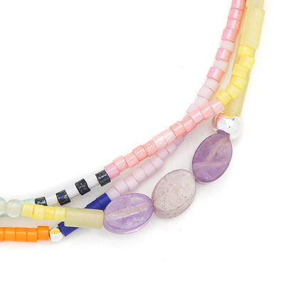 Colorful beaded bracelet on a white background