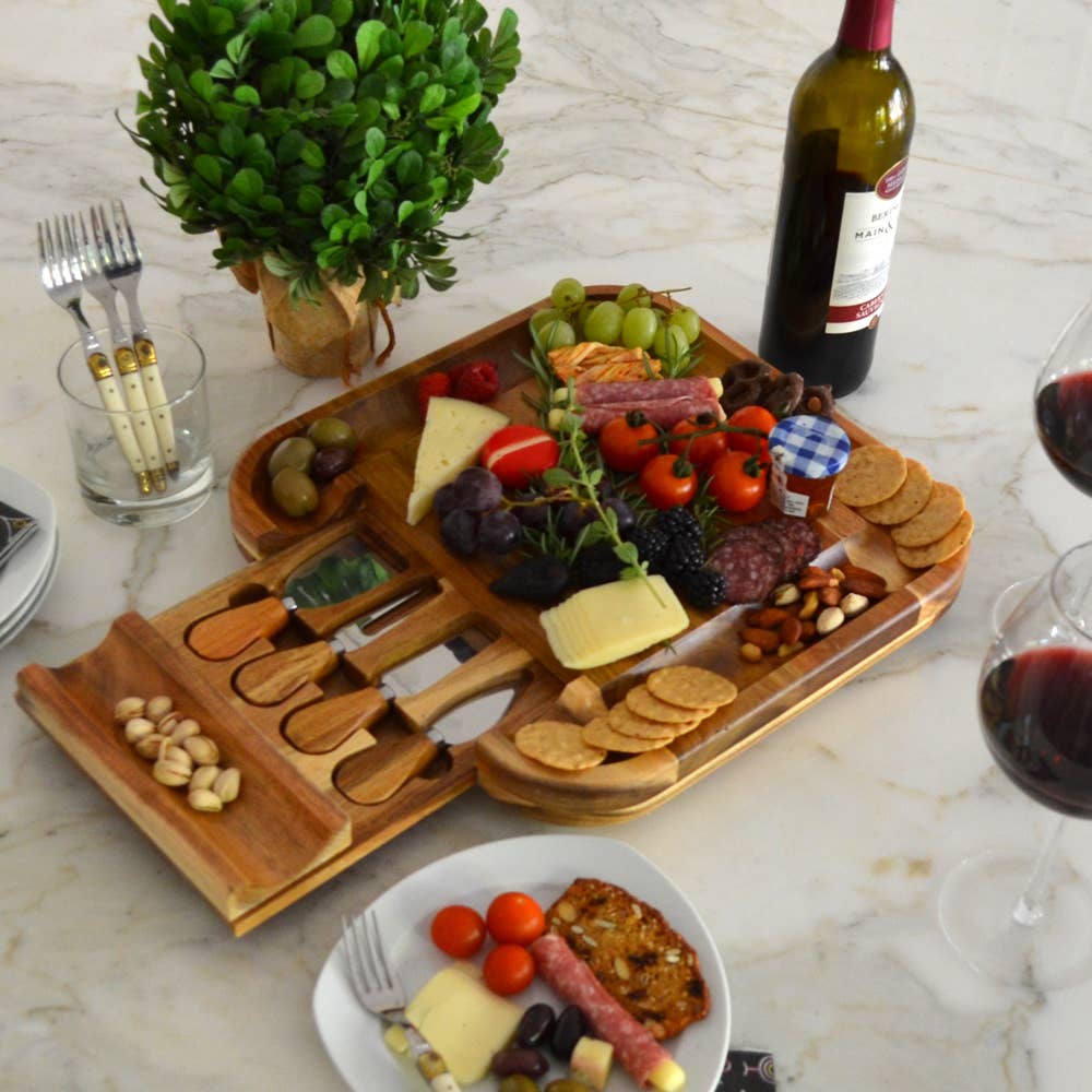 Wooden charcuterie board with assorted foods on a marble surface, accompanied by wine and glasses. All images associated with this listing show the same piece from various angles and with different styling props.
