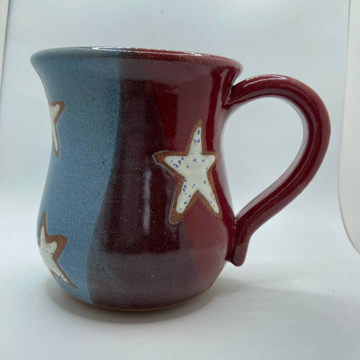 Ceramic mug with star design on a white background