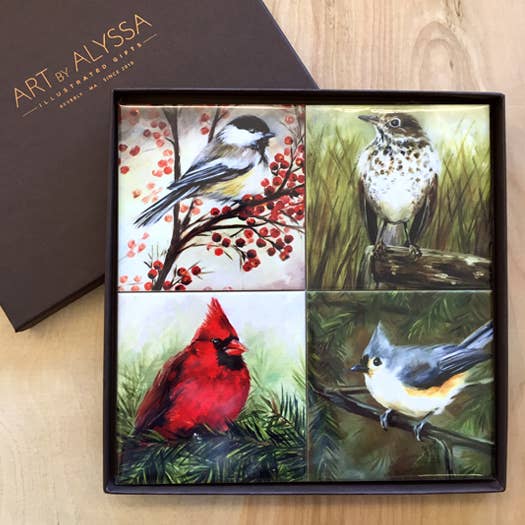 Set of four bird paintings in a gift box with 'Art by Alyssa' branding.