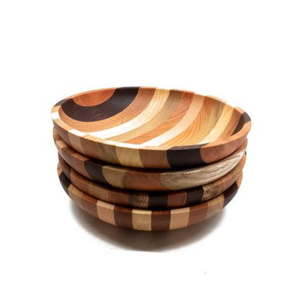 Stack of wooden bowls with striped pattern on a white background