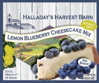 Halladay's Harvest Barn lemon blueberry cheesecake mix packaging with cheesecake slice and blueberries.