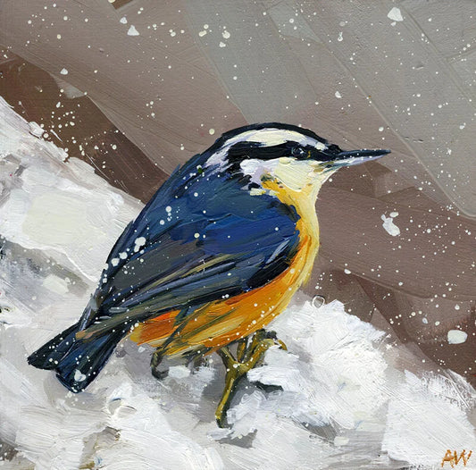 Trivet with a colorful bird perched on a branch with a snowy background.