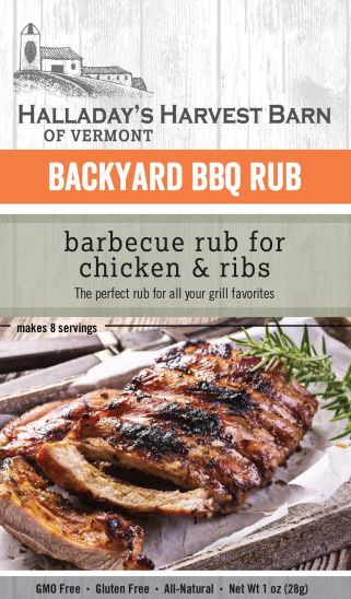 Packaging of Halladay's Harvest Barn Backyard BBQ Rub for chicken and ribs with a wooden background.