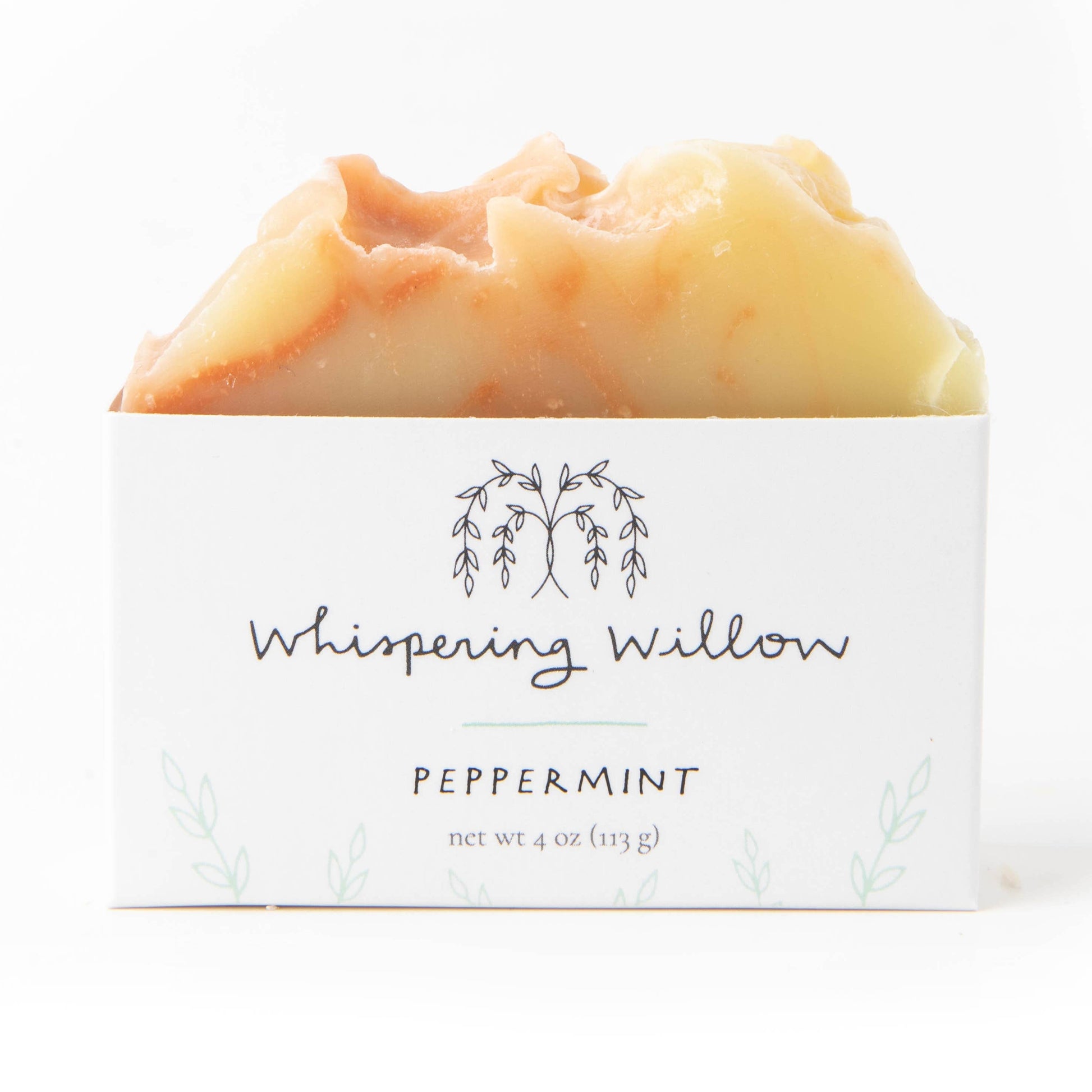 Bar of soap with 'Whispering Willow' branding on a white background