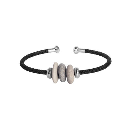 Bracelet with black cord and silver and stone beads on a white background