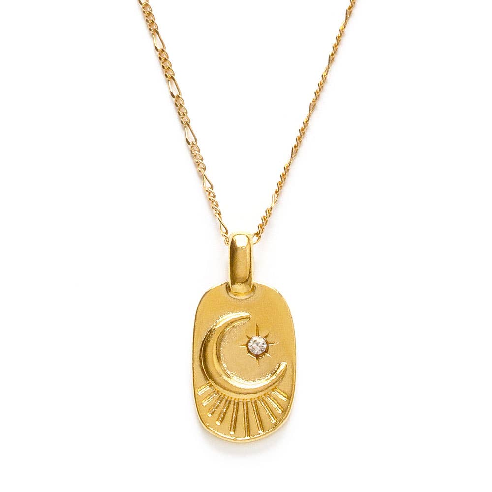 Gold necklace with a crescent moon pendant on a white background