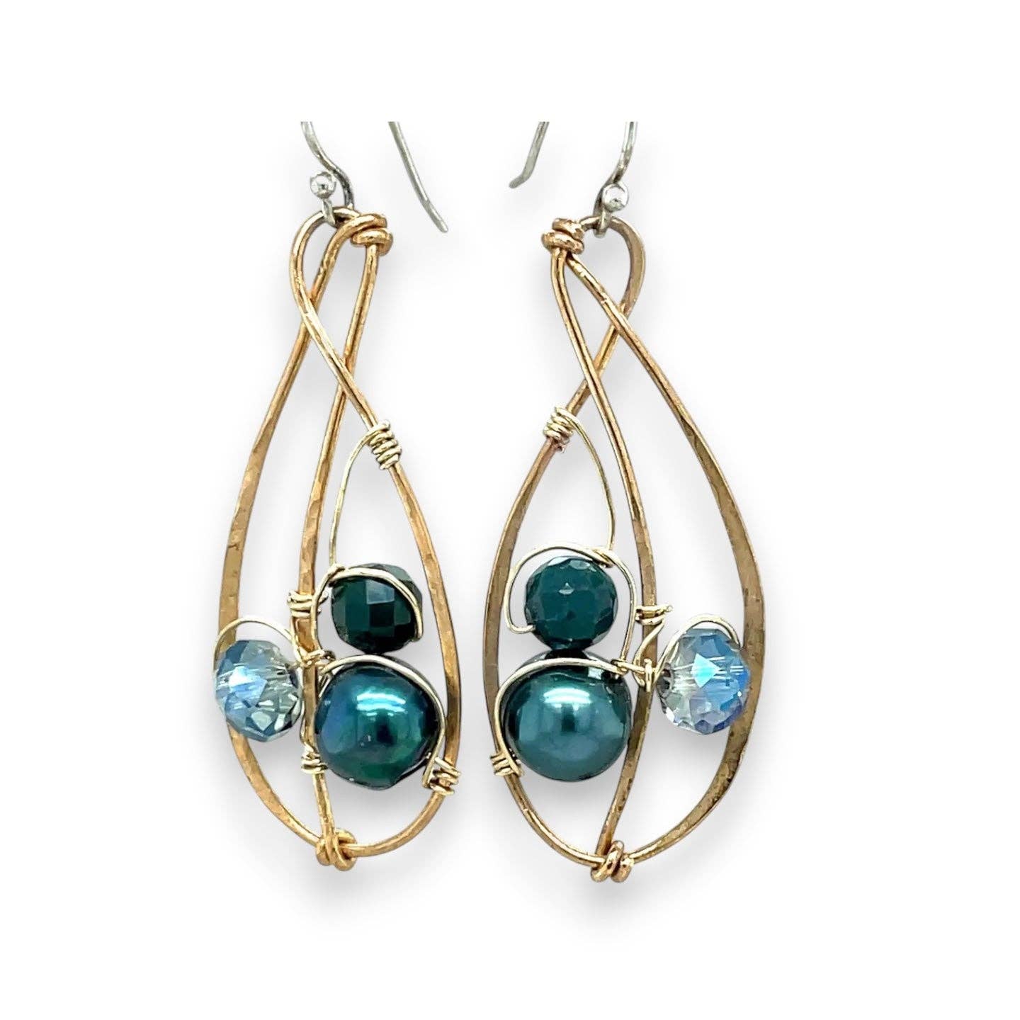 Gold-framed earrings with blue beads on a white background