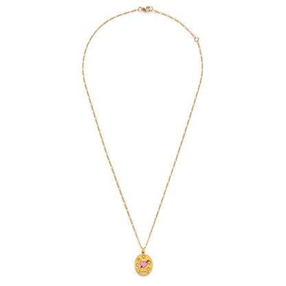 Gold necklace with an oval pendant on a white background