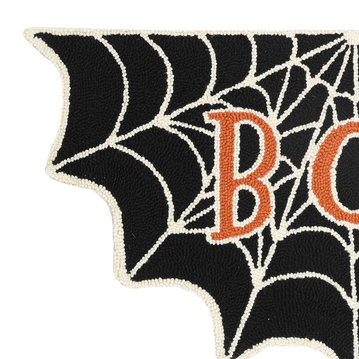 Close-up of a Halloween-themed rug corner featuring a black cobweb design with white web lines and orange embroidered letters 'BO' on a white background.