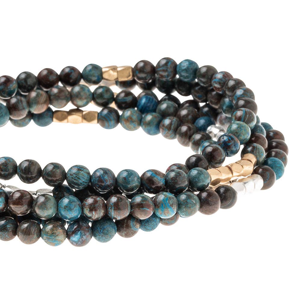 Convertible beaded necklace/wrap bracelet on a white background