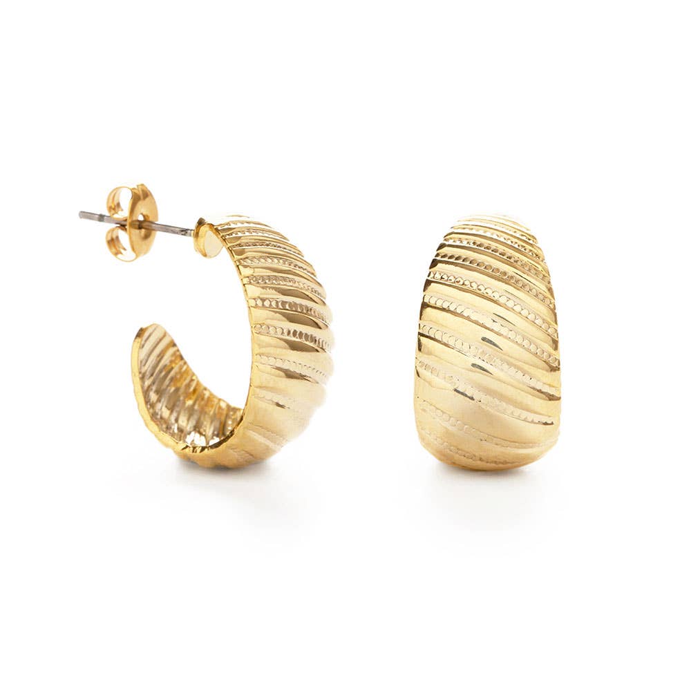 Gold hoop earrings on a white background