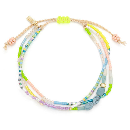 Set of colorful beaded bracelets on a white background