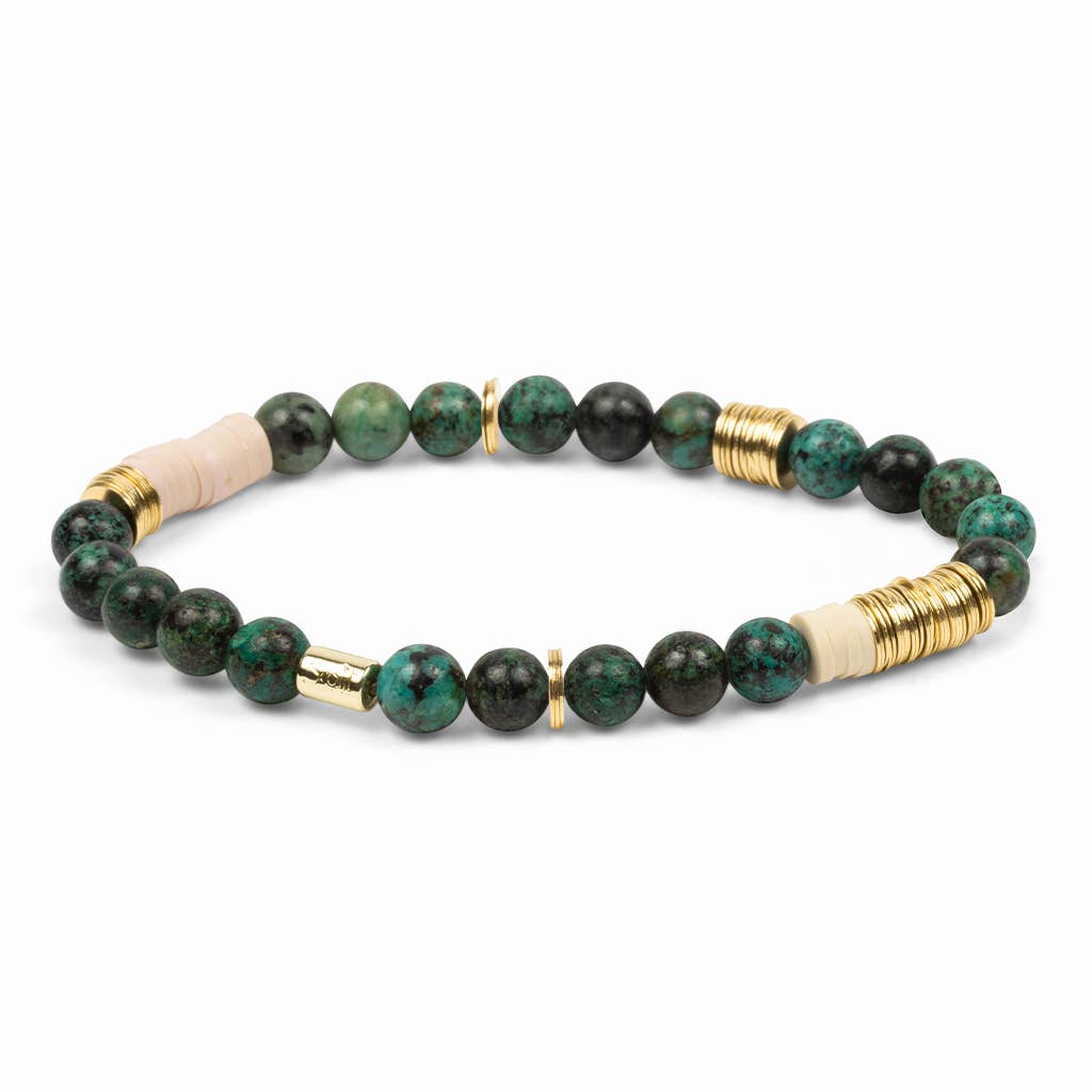 Beaded bracelet with green, black, and gold beads on a white background