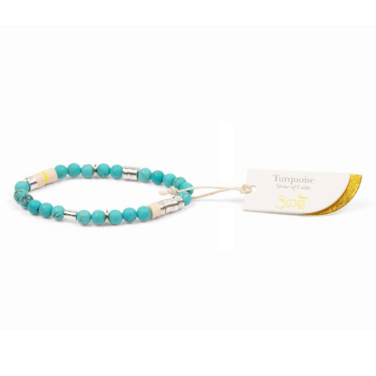 Turquoise beaded bracelet with silver accents on a white background