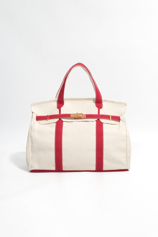 Beige tote bag with red straps and trim on a white background