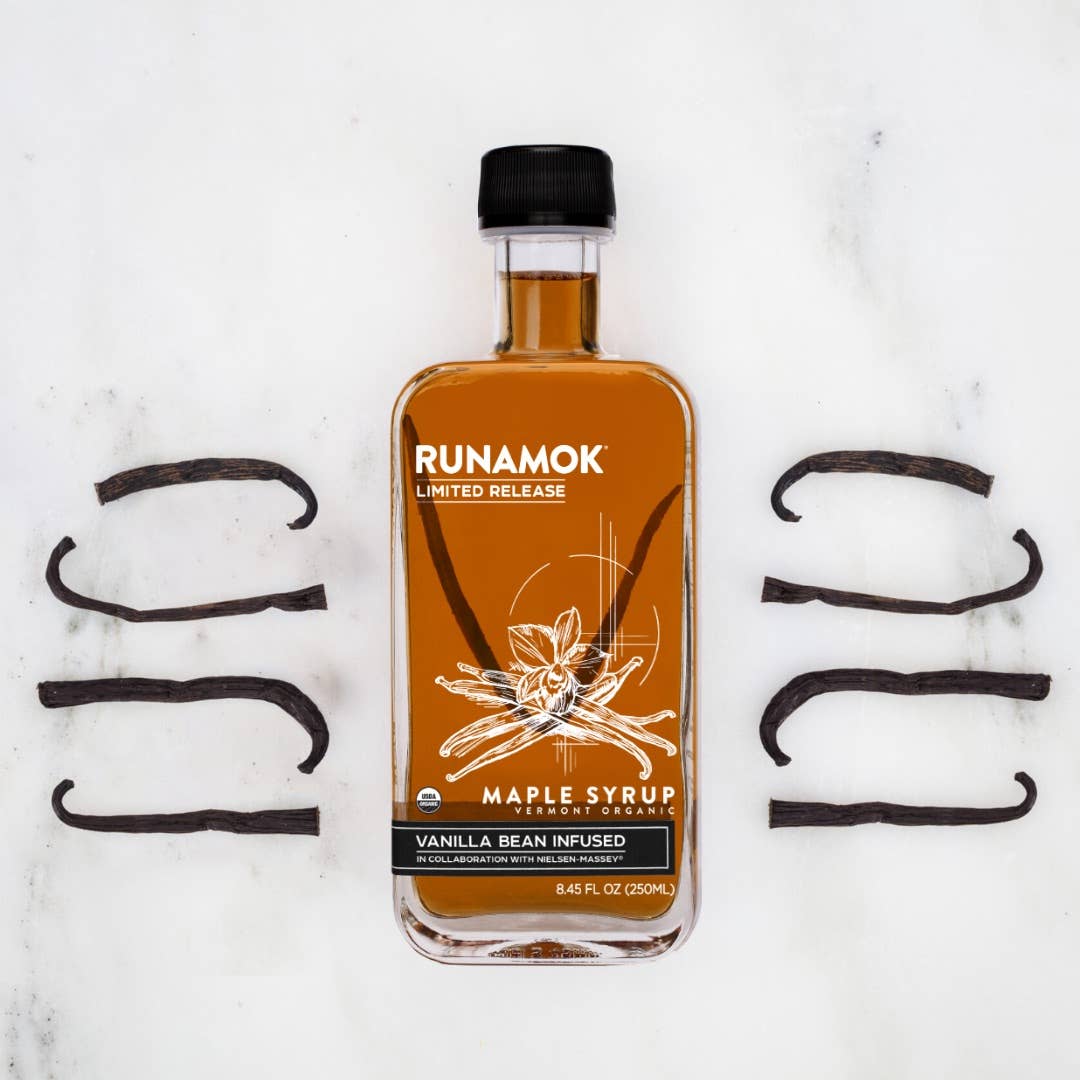 Bottle of Runamok maple syrup with vanilla bean on a white background