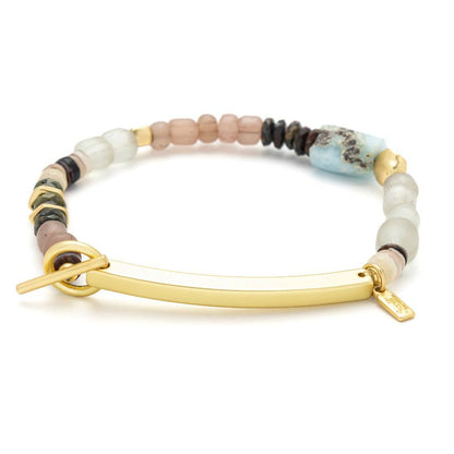 Bracelet with multicolored beads and gold clasp on a white background