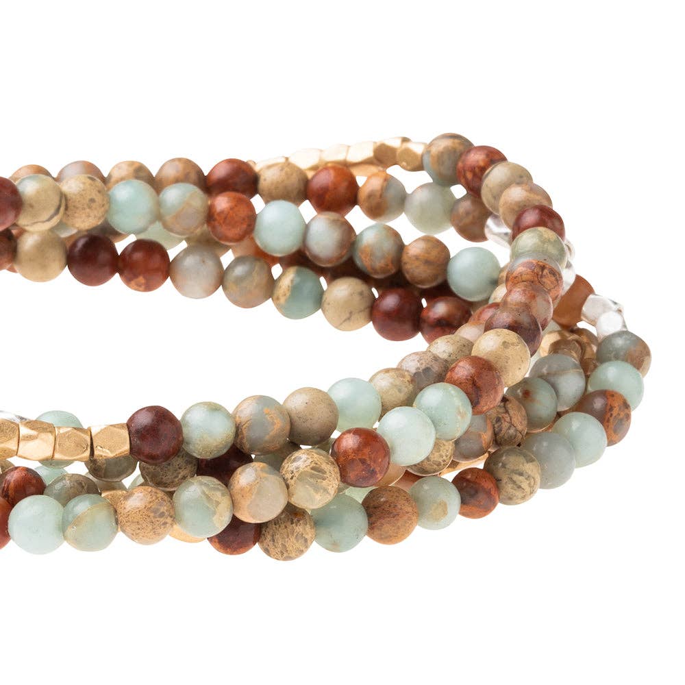 Convertible beaded necklace/wrap bracelet on a white background