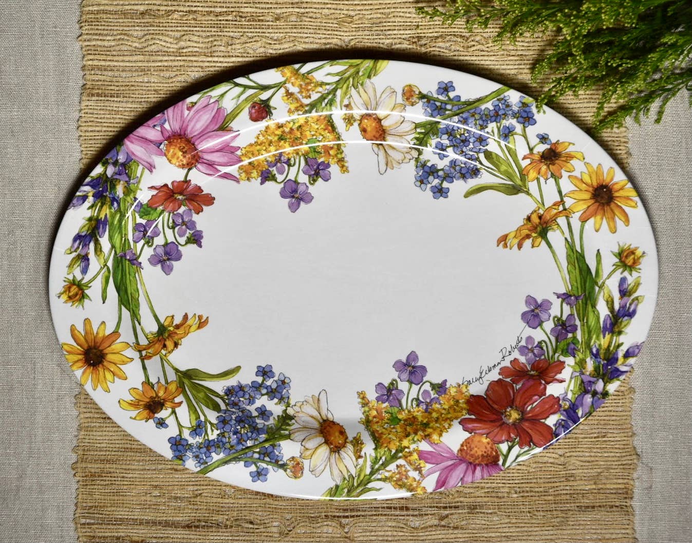 Decorative plate with floral design on a textured surface