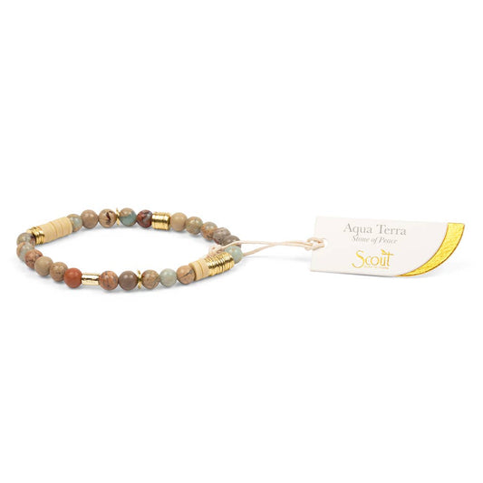 Beaded bracelet with gold accents on a white background, featuring the Scout brand.