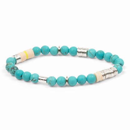 Turquoise beaded bracelet with silver and yellow accents on a white background