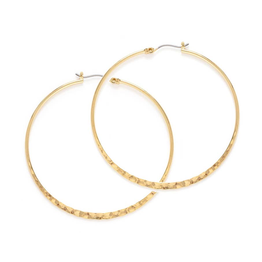 Gold hoop earrings on a white background