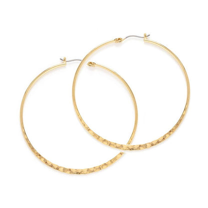 Gold hoop earrings on a white background