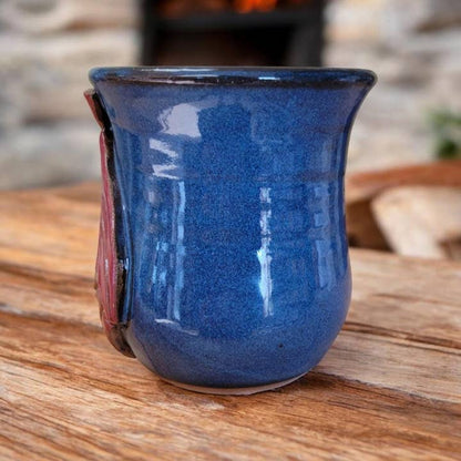 Blue ceramic mug on a wooden surface