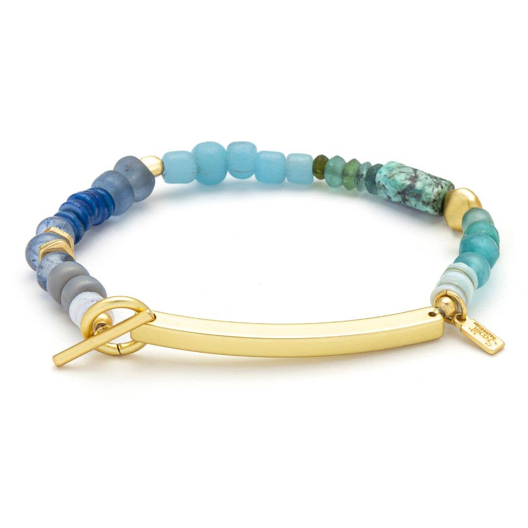 Multicolored beaded bracelet with a gold clasp on a white background