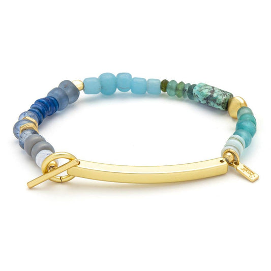 Multicolored beaded bracelet with a gold clasp on a white background