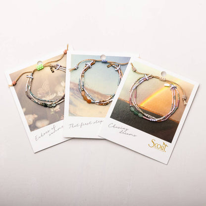 Three jewelry cards with beaded bracelets on a light gray background