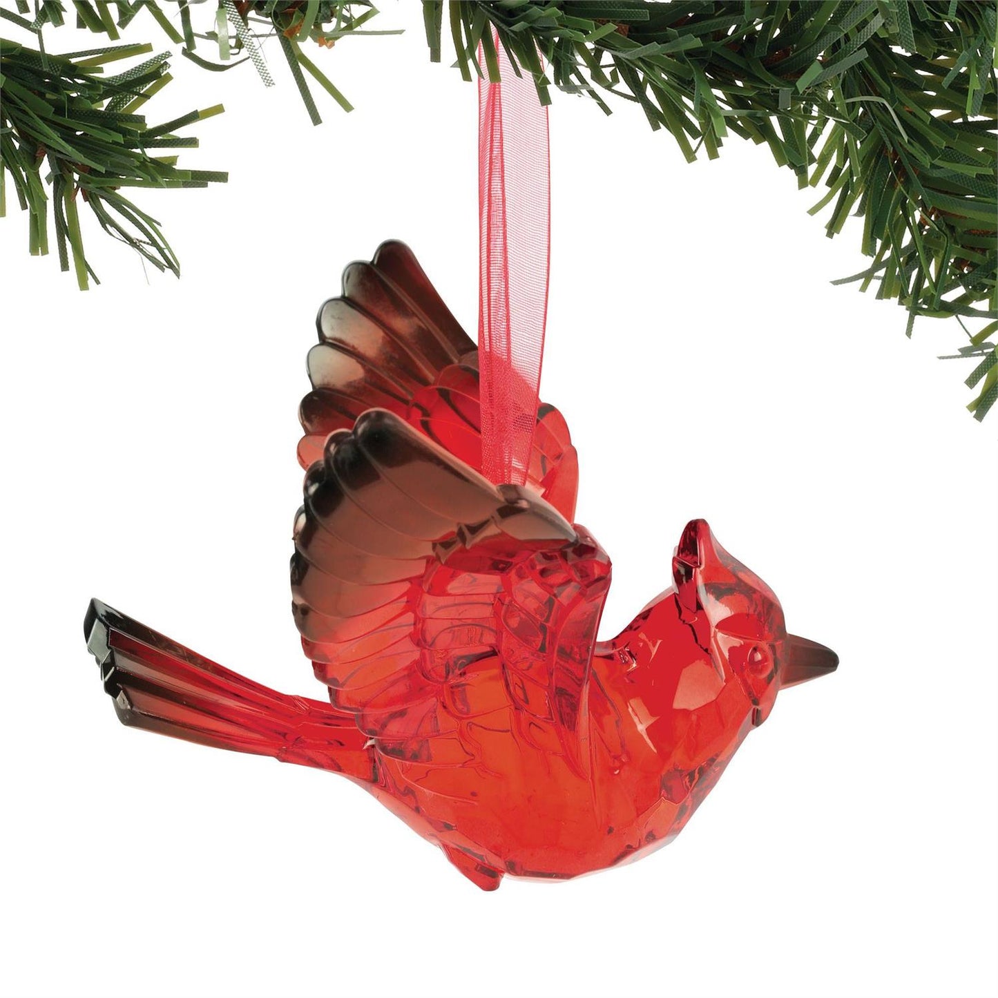 Red cardinal ornament hanging from a green branch