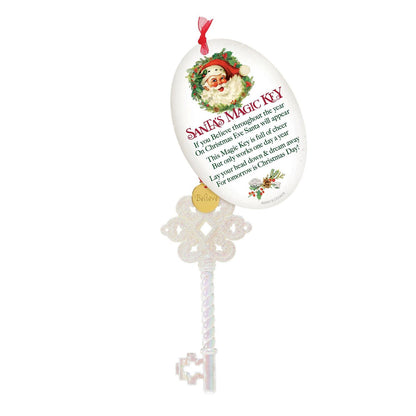 Decorative key ornament with Santa Claus illustration and text on a white background