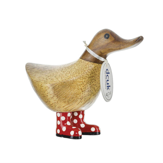 Wooden duck figurine with red shoes and a tag on a white background