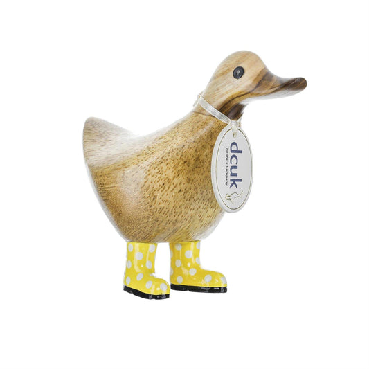 Duck figurine with yellow polka dot boots and a tag on a white background