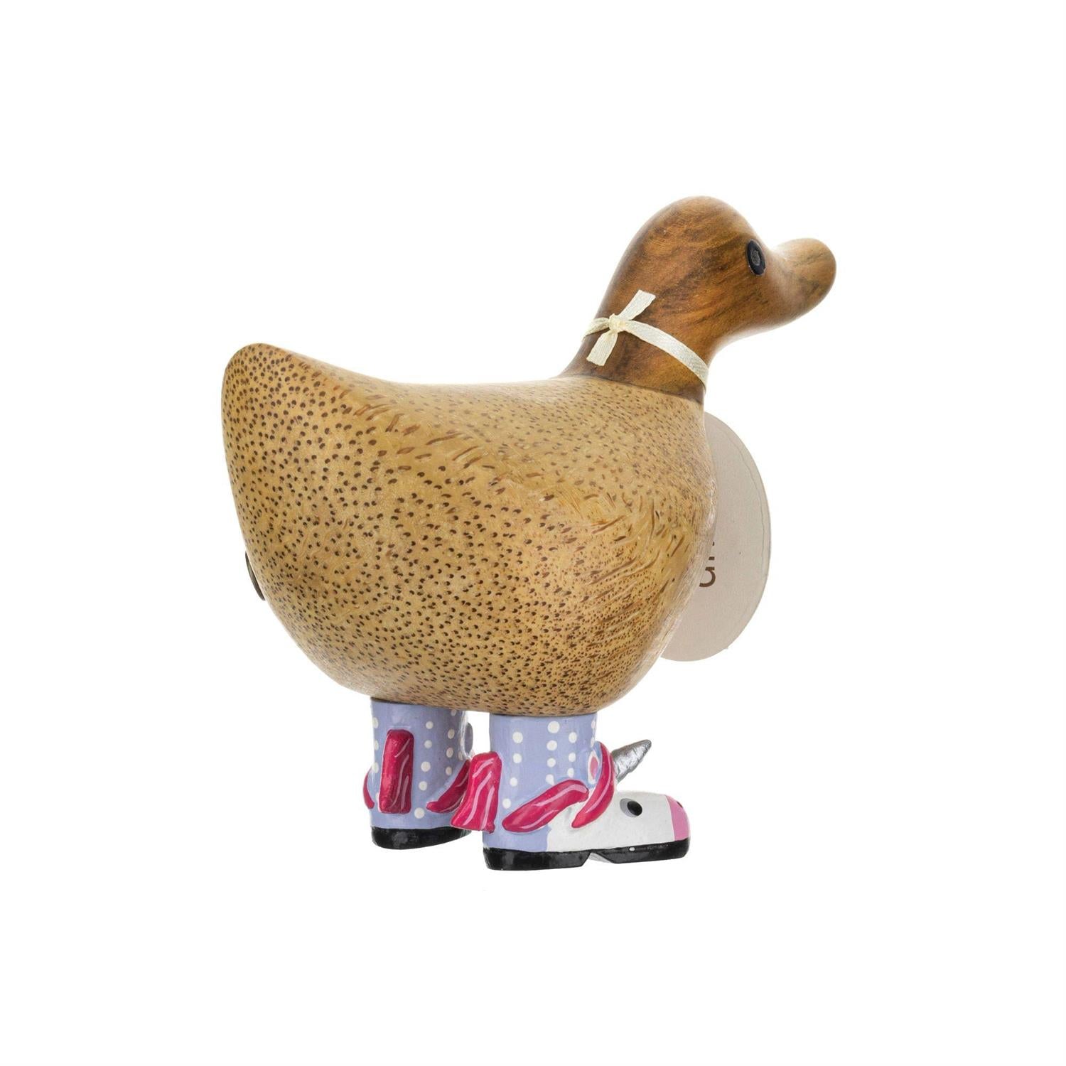 Wooden duck figure with unicorn boots on a white background