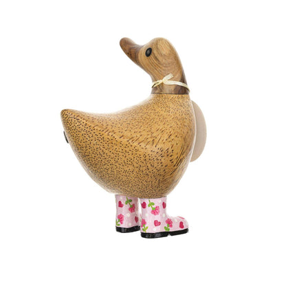 Decorative duck figure with pink boots on a white background