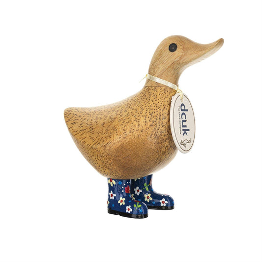Wooden duck figurine with floral wellies and a tag on a white background