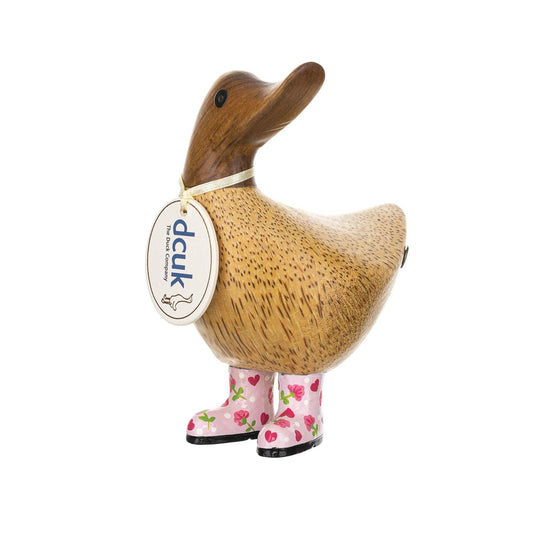 Wooden duck figurine with pink boots and a visible brand tag on a white background