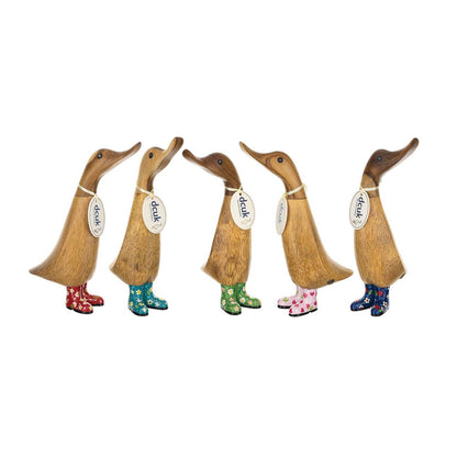 Five decorative ducks with colorful boots on a white background