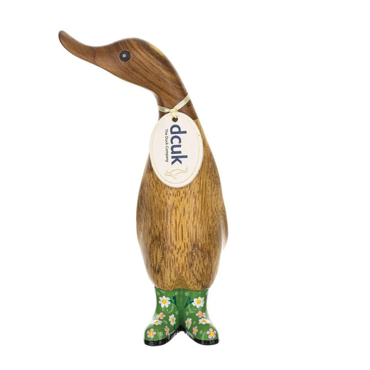 Wooden duck figurine with floral-patterned boots and a tag on a white background
