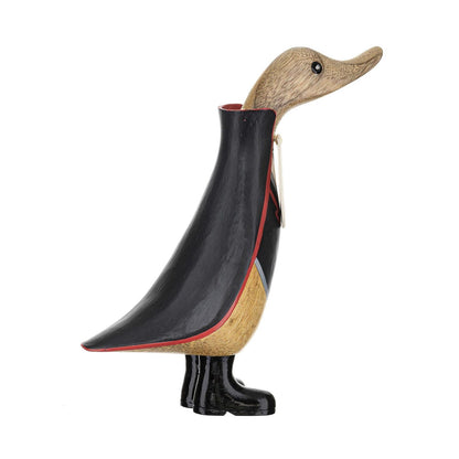 Wooden duck figurine with a black jacket on a white background