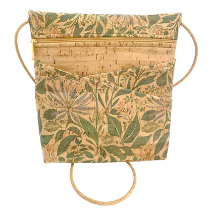 Floral-patterned cork handbag with strap on a white background