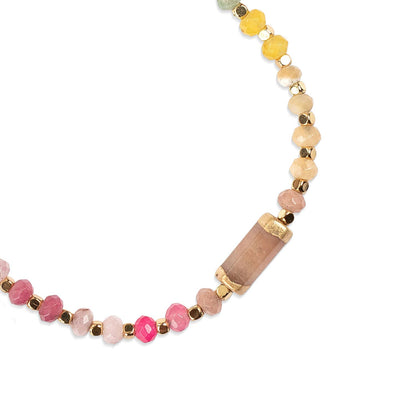 Bracelet with multicolored beads on a white background