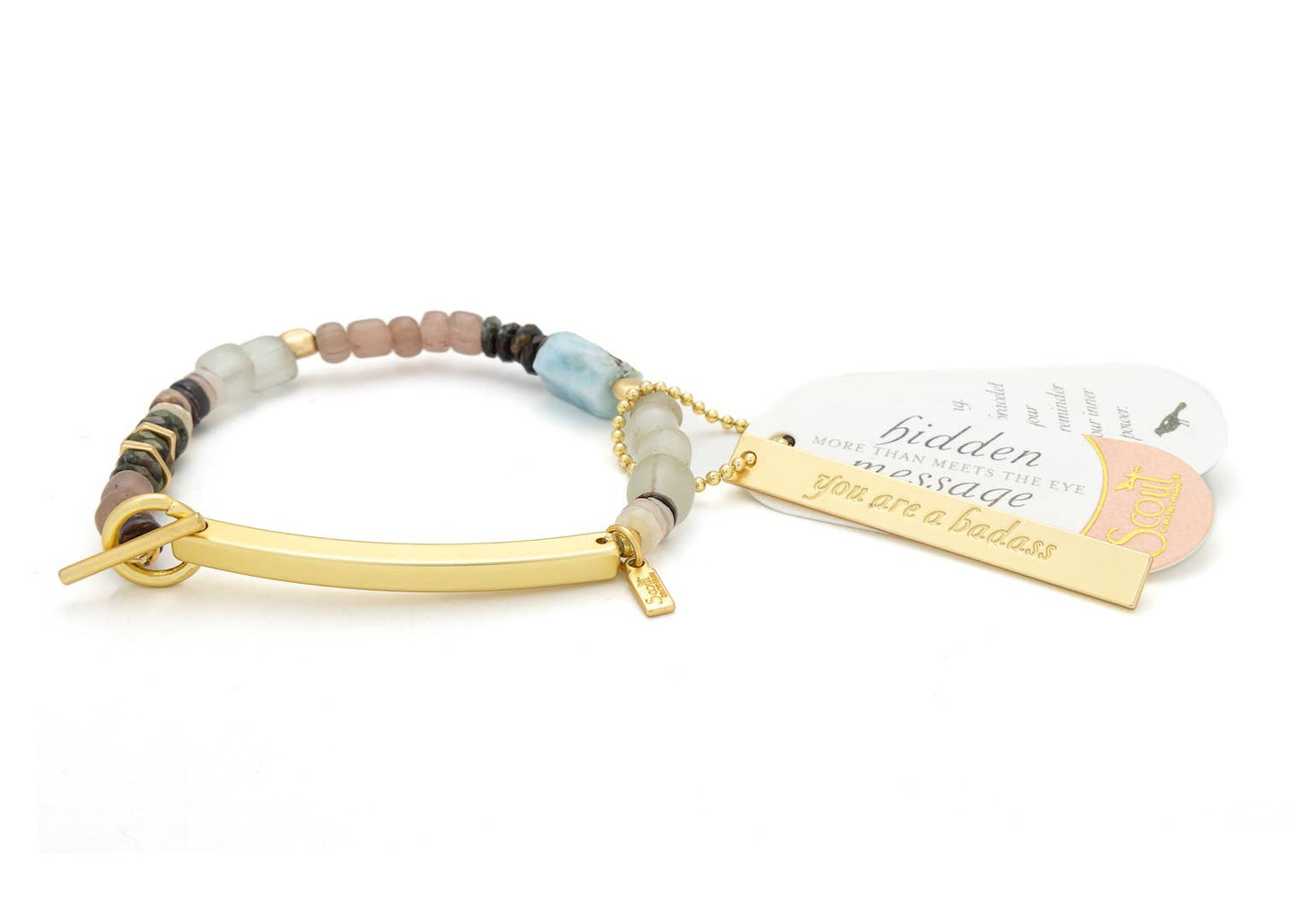 Bracelet with beaded design and gold clasp on a white background